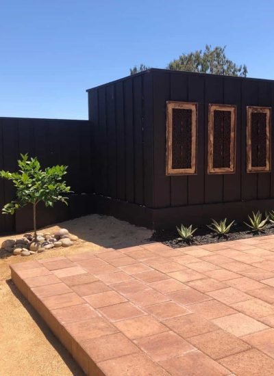 Outdoor patio with fire feature, drought-tolerant plants, and modern landscaping.